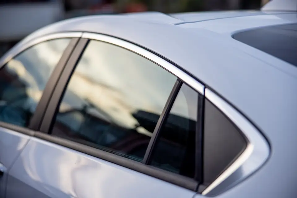 Close-up of a flawless silver car body panel after repair