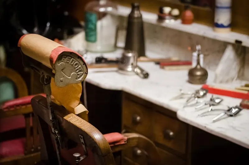 Classic barber chair at a marble station with tools laid out
